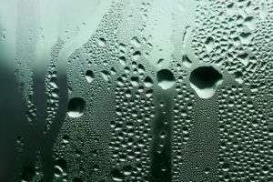 Condensation on a window which can be reduced with a home dehumidifier