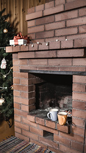 A fireplace which has soot damage