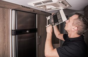 Professional cleaning air ducts in a home
