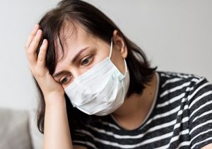 Woman suffering from allergies due to unclean air ducts